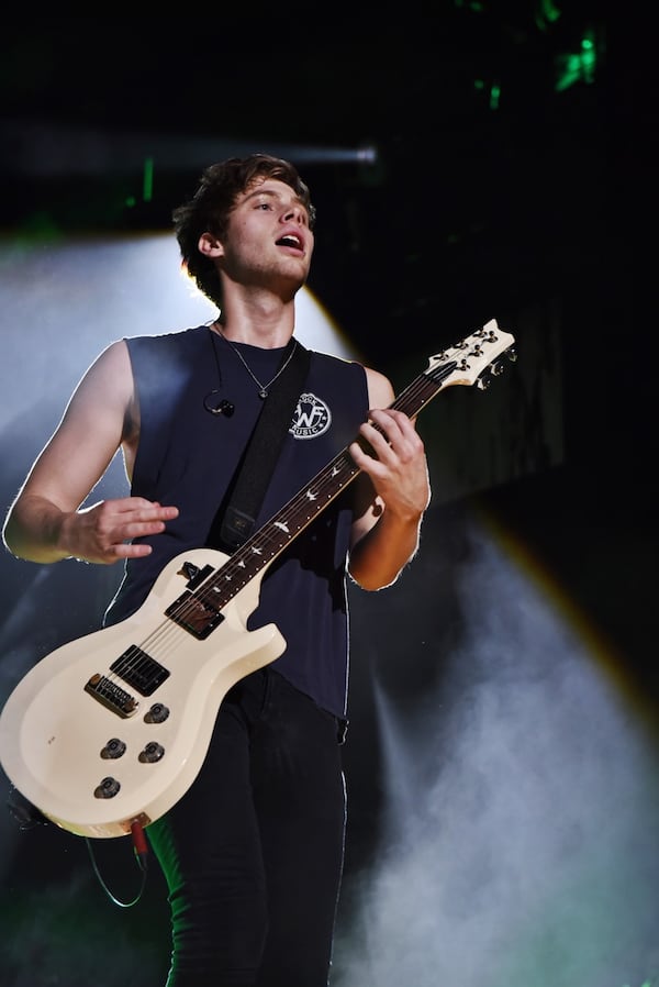 Luke Hemmings plays to the frenzied crowd. Photo: Kate Teegardin/Special to the AJC.