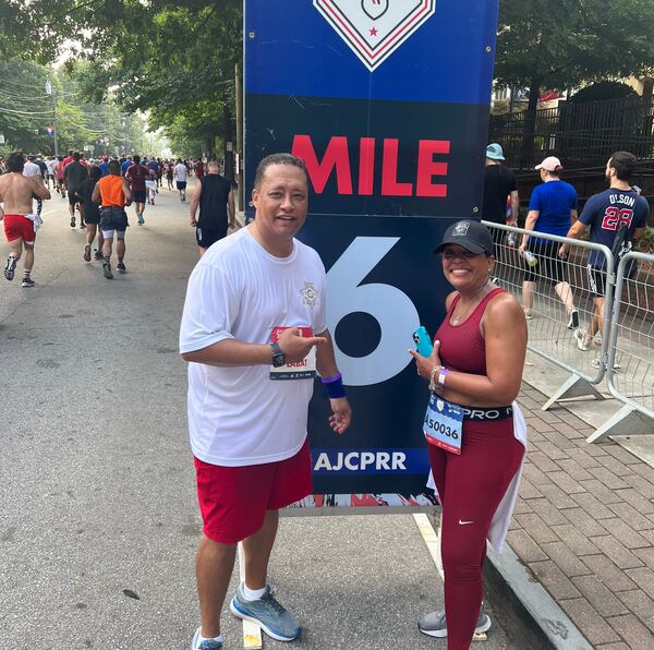 Fulton County Sherriff Patrick Labat (left) has run the AJC Peachtree Road Race nearly every year since the early 1990s. He's seen here with his wife Jacki. Photo courtesy of the Fulton County Sherrif's Office