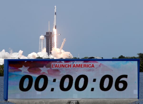 A SpaceX Falcon 9, with NASA astronauts Doug Hurley and Bob Behnken in the Dragon crew capsule, lifts off from Pad 39-A at the Kennedy Space Center.