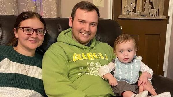 Brian and Cassidy Johnson with their 10-month-old son