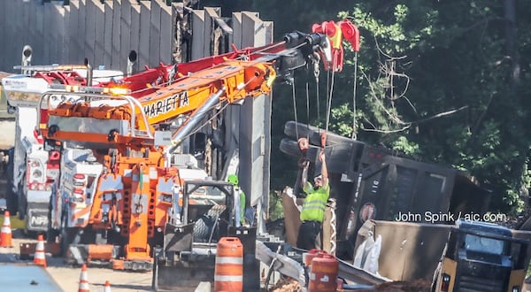 The crash shut down I-75 North near Wade Green Road. JOHN SPINK / JSPINK@AJC.COM