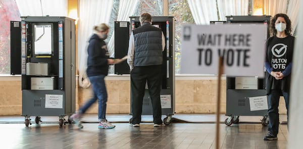 Voters cast ballots at Park Tavern in the runoff election for Atlanta mayor on Tuesday, November 30, 2021. (John Spink / John.Spink@ajc.com)