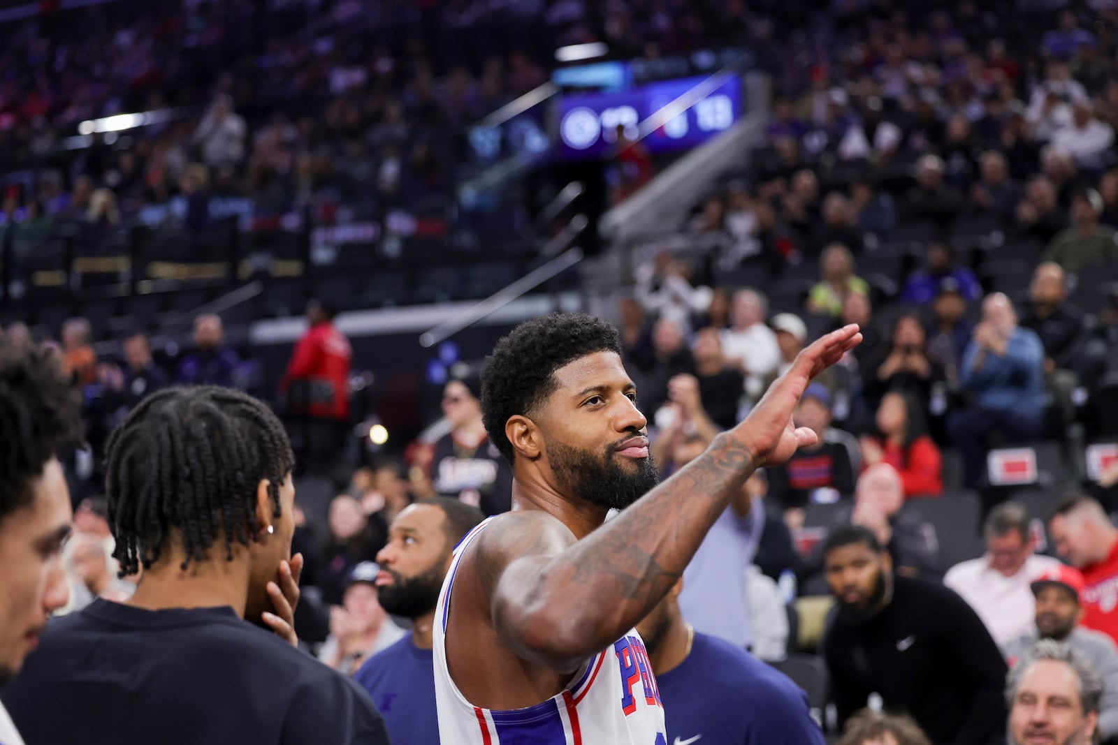 Philadelphia 76ers forward Paul George greets the crowd during the first half of an NBA basketball game, Wednesday against the Los Angeles Clippers, Nov. 6, 2024, in Inglewood, Calif. (AP Photo/Ryan Sun)