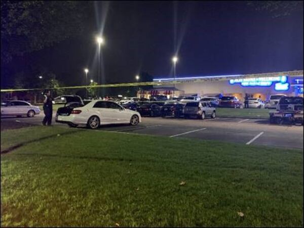 Police said a body was found inside the trunk of a vehicle in the parking lot of a Gwinnett County shopping center late Tuesday night.