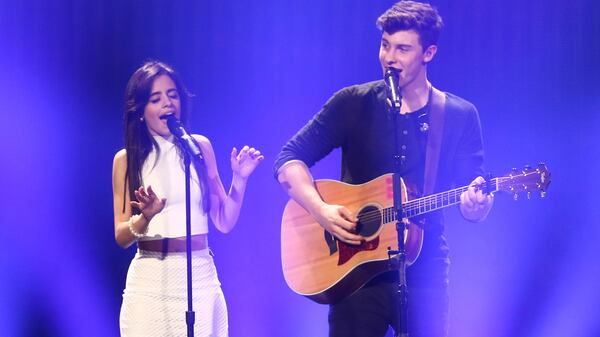 Camila Cabello (L) and Shawn Mendes perform live onstage at Y100's Jingle Ball 2015 Daytime Village at BB. The two will perform at the 61st annual Grammy awards Feb. 10.