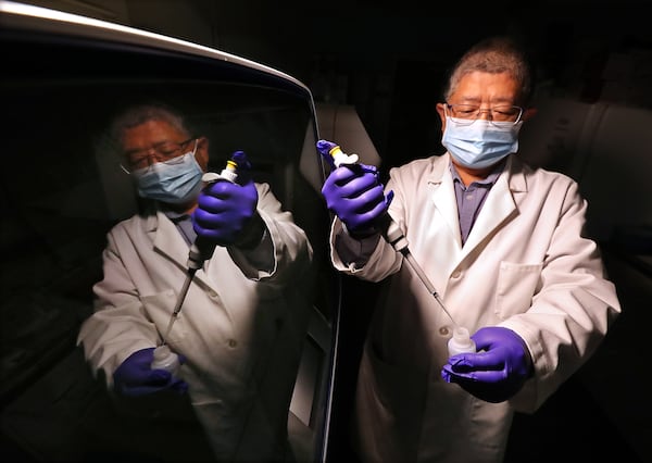 Professor Jin-Xiong She is director of the Center for Biotechnology and Genomic Medicine at Augusta University Medical Center.  Professor She is shown here working in the genomics core laboratory with gene sequencing machinery.  (PHOTO by Curtis Compton / Curtis.Compton@ajc.com )