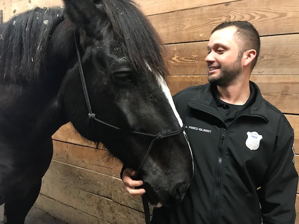 Atlanta Police Department mounted officer Abraham Perez-Gilbert and his horse, Magnum, will be a visible part of crowd control during the Super Bowl. BO EMERSON/BEMERSON@AJC.COM