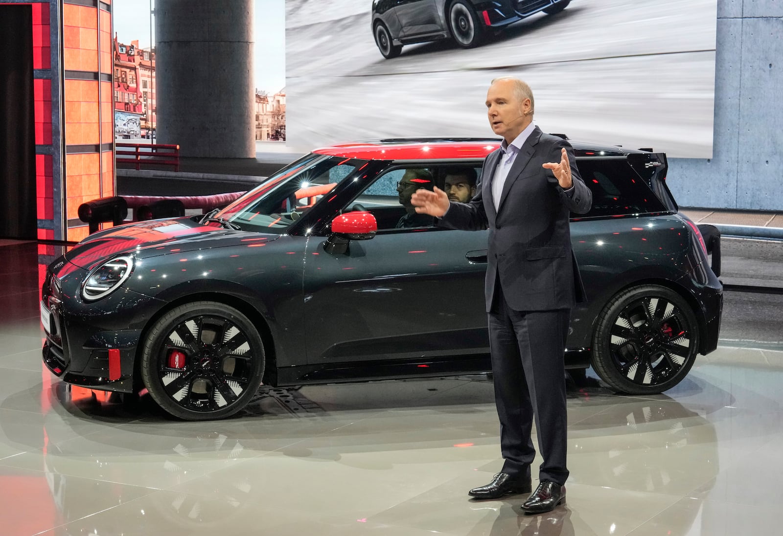 Jochen Goller, Member of the Board of Management of BMW AG, presents the world premiere of the first full-electric MINI John Cooper Works model, at the Paris Auto Show, in Paris, Monday, Oct. 14, 2024. (AP Photo/Michel Euler)