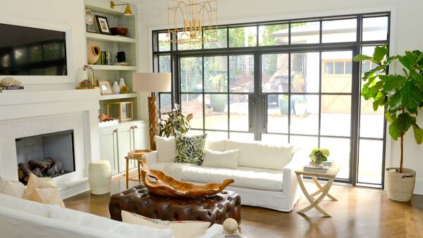 Steel doors open the cozy keeping room to the backyard. The keeping room and the 13-foot doors were part of a rear addition the couple built when they renovated their nearly 100-year-old bungalow in 2016.