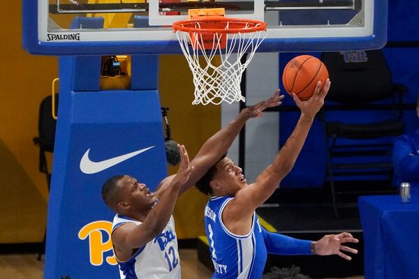 Duke's Jalen Johnson (right) shoots around Pittsburgh's Abdoul Karim Coulibaly (12) on Tuesday, Jan. 19, 2021. (AP Photo/Keith Srakocic)