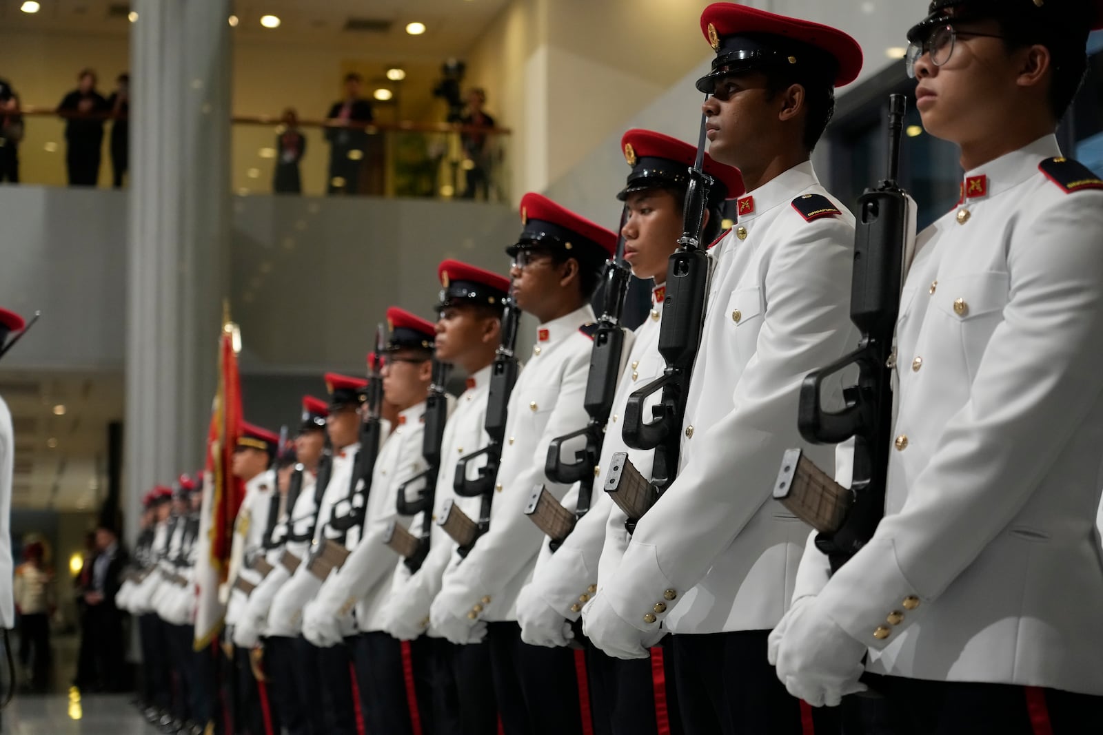 The guard of honor is lined up awaiting the arrival of Pope Francis for a welcome ceremony with the President of the Singapore Republic Tharman Shanmugaratnam at the Parliament House in Singapore, Thursday, Sept. 12, 2024. Pope Francis flew to Singapore on Wednesday for the final leg of his trip through Asia, arriving in one of the world's richest countries from one of its poorest after a record-setting final Mass in East Timor. (AP Photo/Gregorio Borgia)