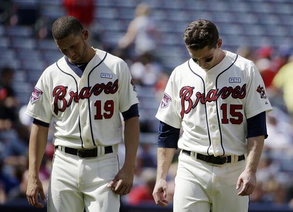 Heads not held high: The story of the 2014 Braves. (David Goldman/AP photo)