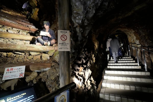 Visitors visit at Sado Kinzan Gold Mine historic site in Sado, Niigata prefecture, Japan, Saturday, Nov. 23, 2024. (AP Photo/Eugene Hoshiko)