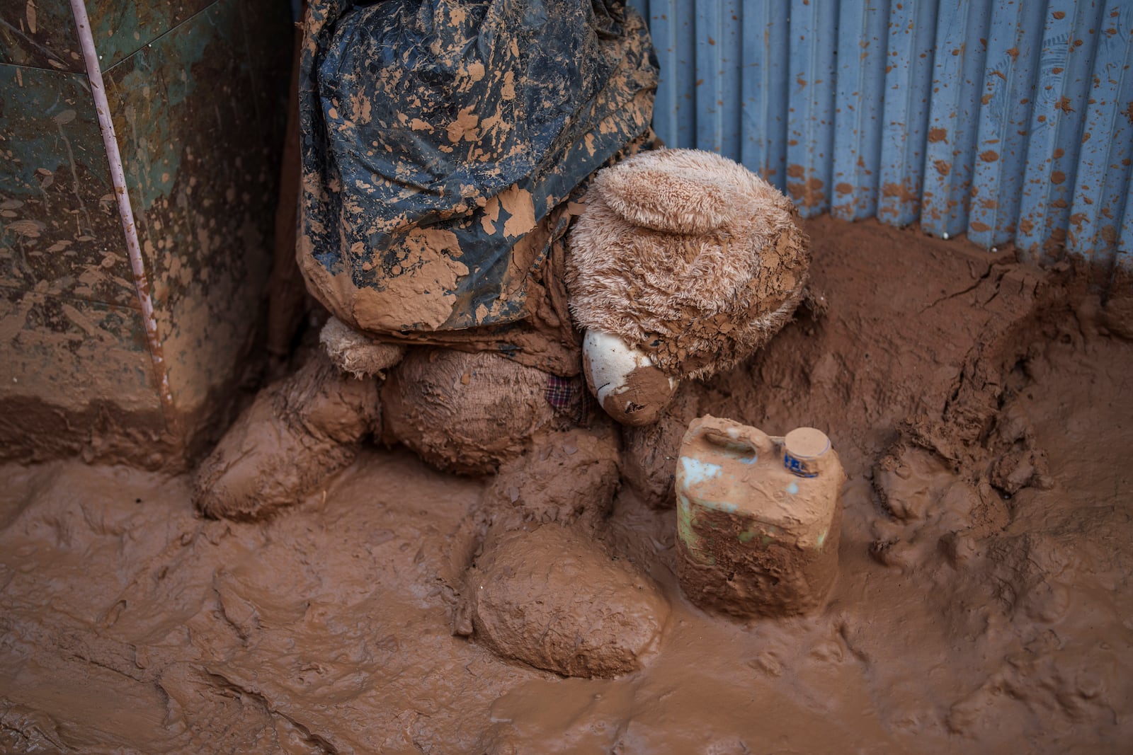 A teddy bear covered in mud is pictures in an area affected by floods in Valencia, Spain, Saturday, Nov. 2, 2024. (AP Photo/Manu Fernandez)