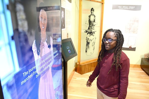 The avatar answers questions from Hardy Elementary student Michael King at Red Clay State Historic Park's new interactive exhibit. (Photo Courtesy of Robin Rudd)