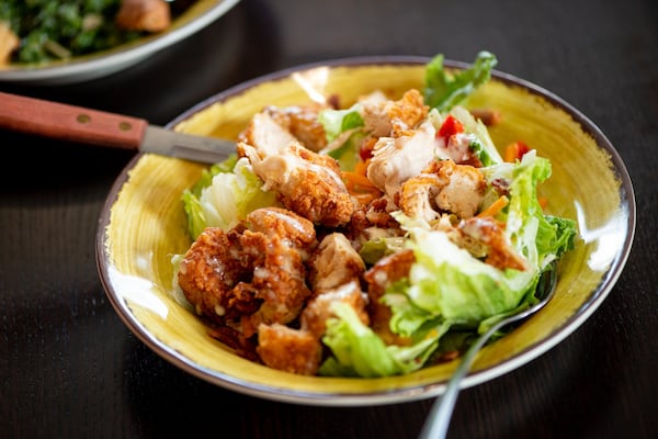 The Wedge salad with fried tenders, peppadews, cheddar, bacon, and red onion. Photo credit- Mia Yakel.