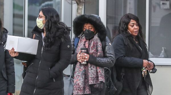 Morning commuters brave the cold Tuesday morning as temperatures dip to freezing for the first time in three weeks in Atlanta.