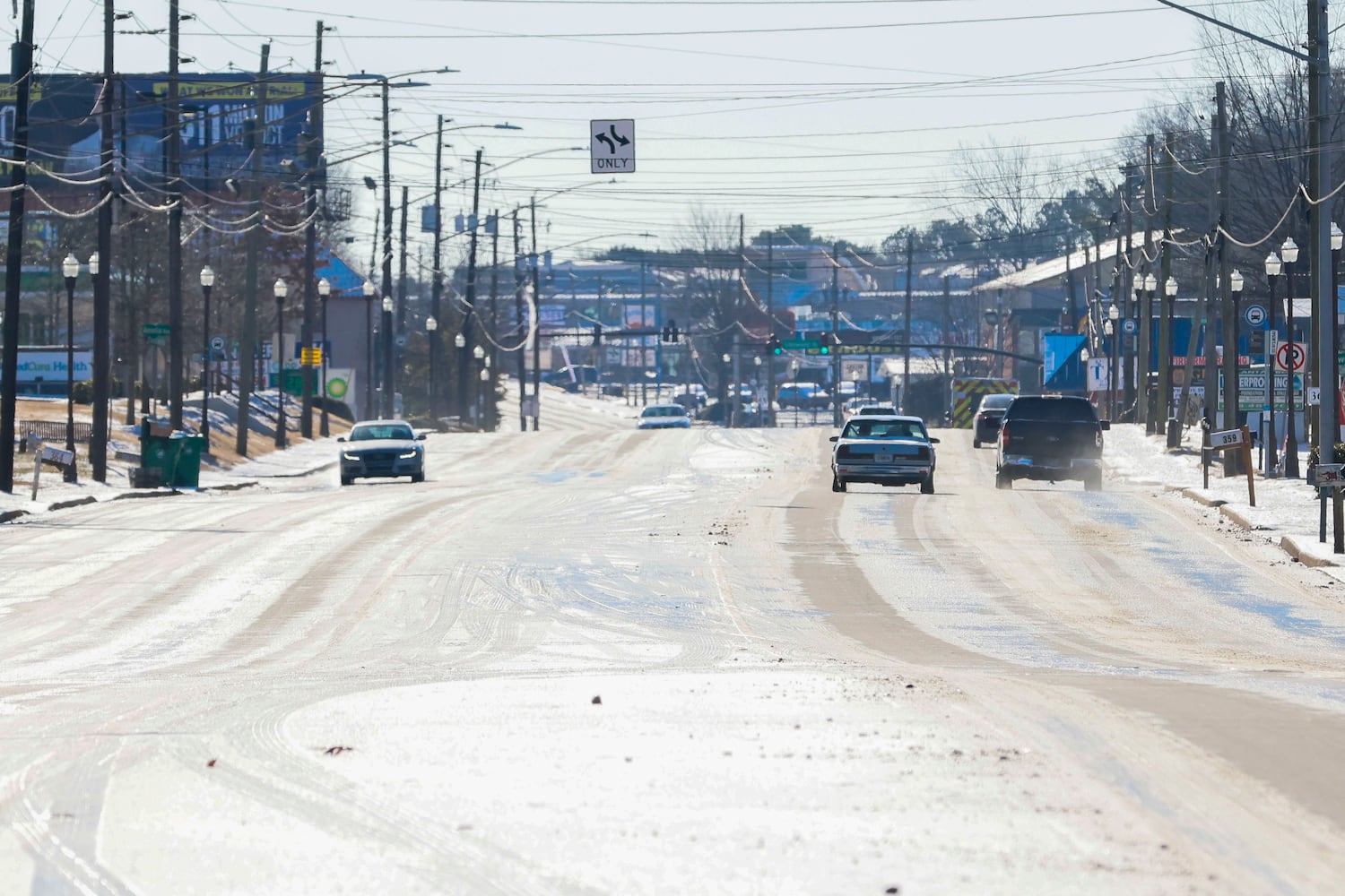 A few cars are circulating by Candler Rd in Dekalb County a day after a winter storm hit Metro Atlanta. On Wednesday, January 22, 2025, authorities advised people to stay home due to the icy road conditions.
(Miguel Martinez/ AJC)