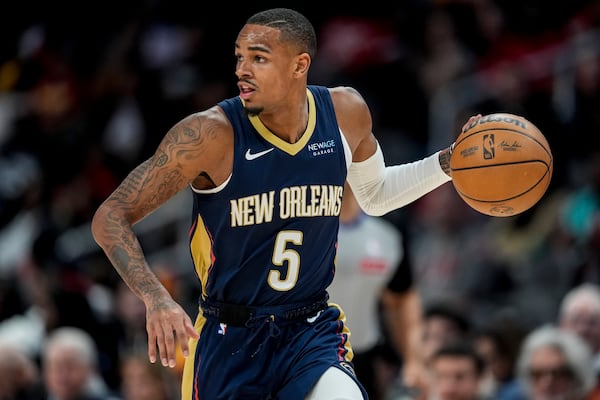 New Orleans Pelicans guard Dejounte Murray (5) moves the ball against the Atlanta Hawks during the first half of an NBA basketball game, Monday, Dec. 2, 2024, in Atlanta. (AP Photo/Mike Stewart)