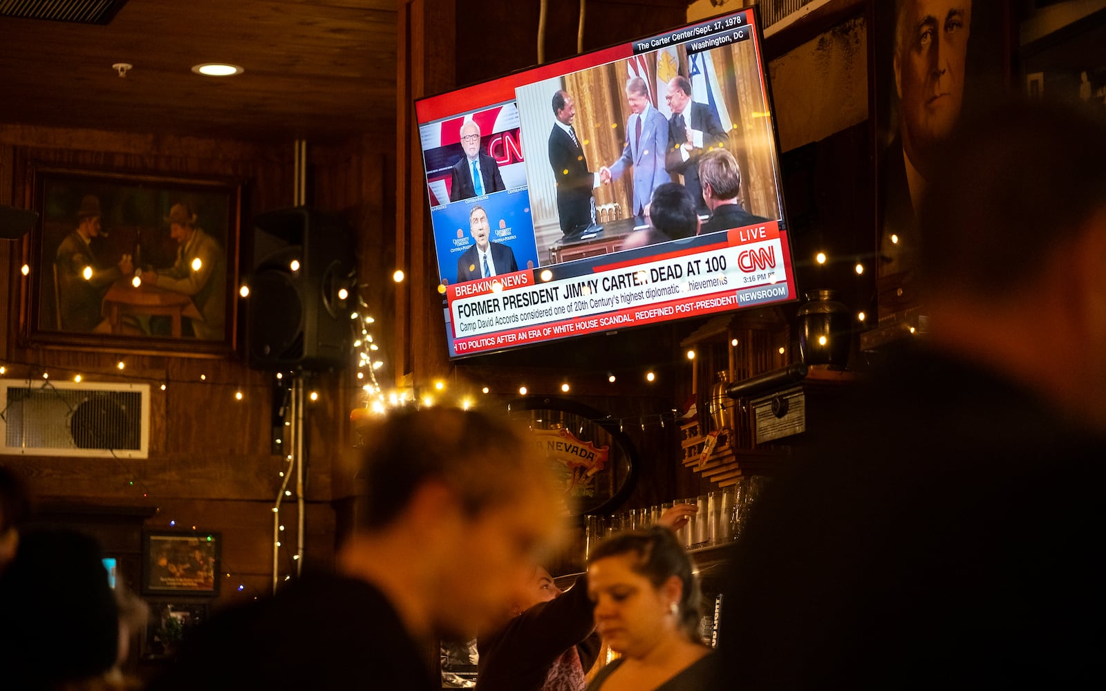 People react to President Jimmy Carter's death at Manuel's Tavern 