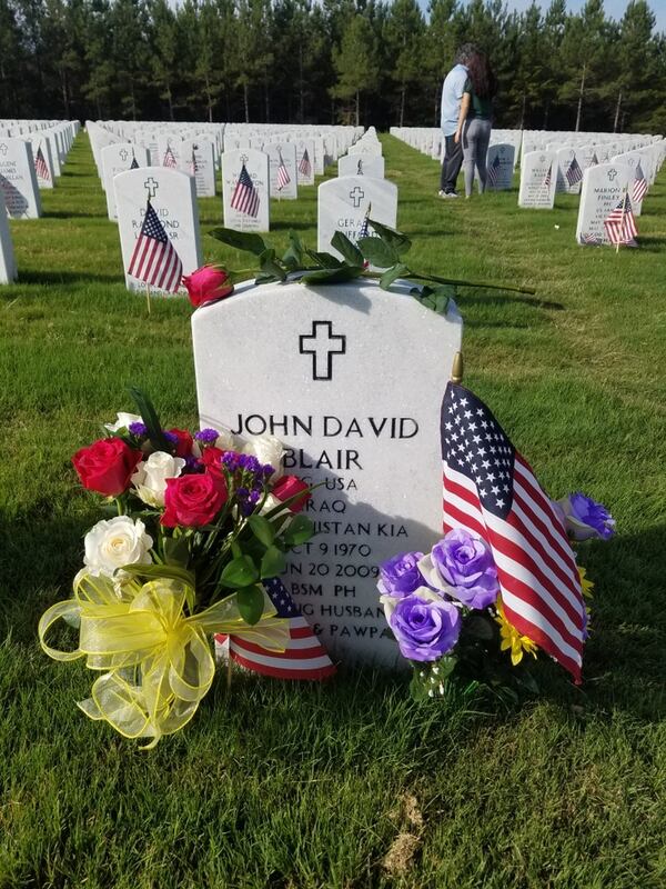 1st Sgt. John Blair died in 2009 at age 38 from an RPG strike in Afghanistan. This photo was taken by his family during a visit to the Georgia National Cemetery in Canton on Memorial Day by his widow, Donna Blair, and his stepson, Dallas Bryant.