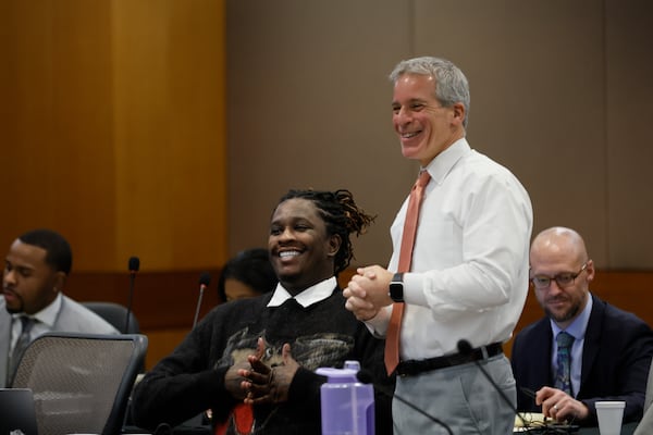 Defense attorney Brian Steel and his client, rapper Young Thug, react moments before his trial enters the second week at Fulton County Courthouse on Monday, Dec. 4, 2023.
Miguel Martinez /miguel.martinezjimenez@ajc.com