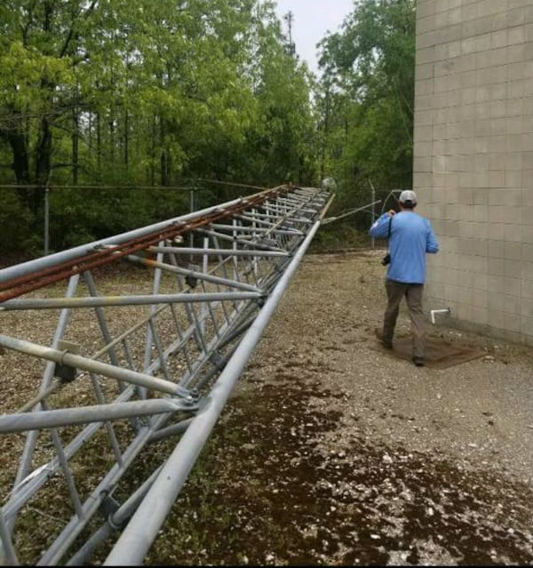 A photo from the Washington County Sheriff's Office shows the scene where three men were caught Sunday, April 7, 2019, dismantling a 150-foot cell tower they are accused of downing in McIntosh, Alabama, a few days before. Pieces of the tower were found loaded into a suspect's pickup truck, authorities said.