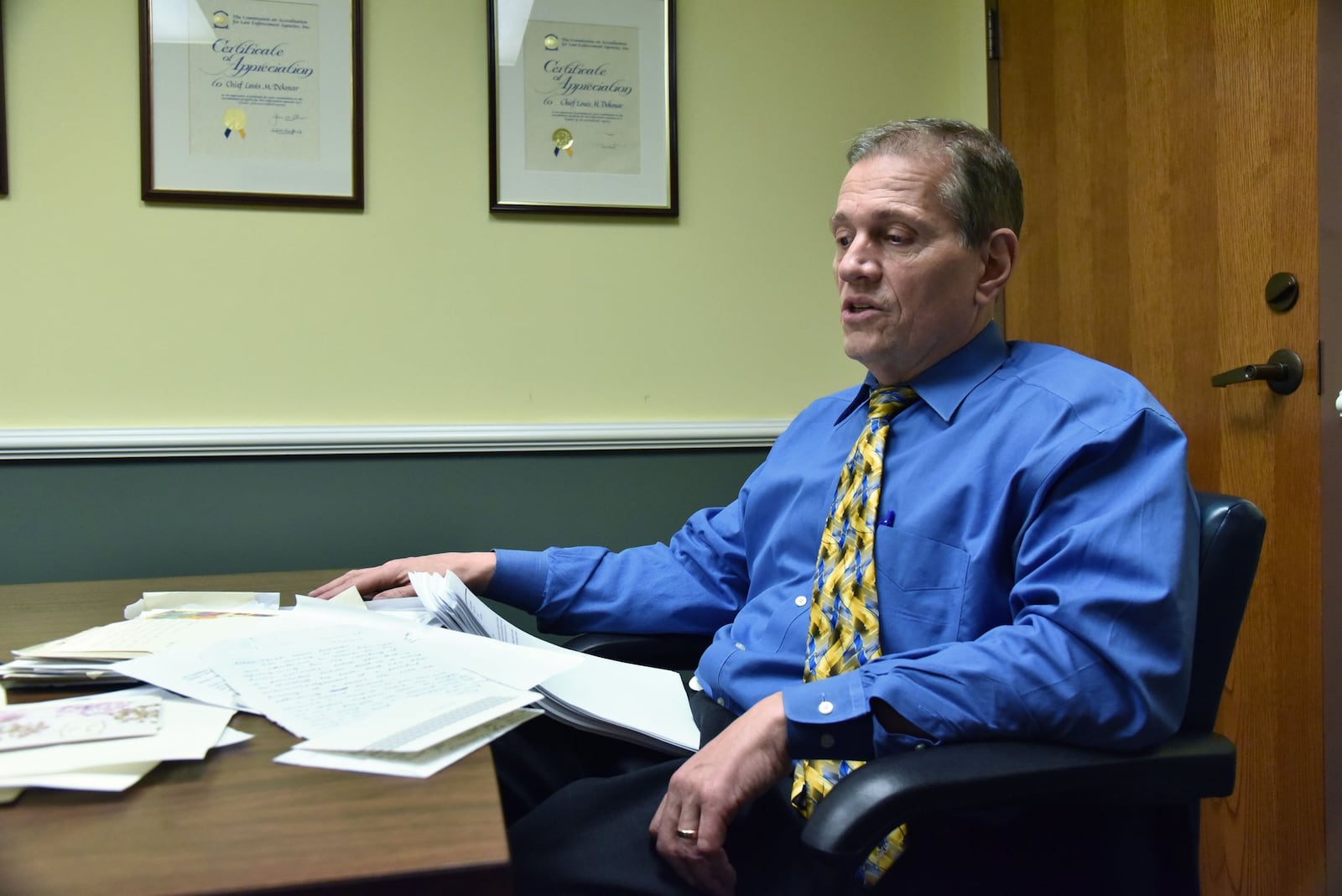 LaGrange Police Chief Lou Dekmar goes through letters and emails he received after he publicly apologized Jan. 26 for the lynching of Austin Callaway more than 75 years ago, at LaGrange Police Department on March 2, 2017. The apology grew out of an effort to ease racial tensions in the community. HYOSUB SHIN / HSHIN@AJC.COM