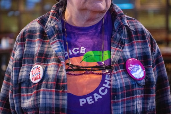 111419 NORCROSSâ€” Activist Peggy Casey joins other Gwinnett Democrats gather to watch the presidential debates held in Atlanta Wednesday, November 20, 2019 at Mazzyâ€™s Sports Bar in Norcross, Ga. PHOTO BY ELISSA BENZIE