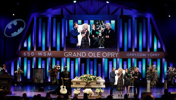 The group Little Big Town performs during a memorial service for country music singer Troy Gentry at the Grand Ole Opry House Thursday, Sept. 14, 2017, in Nashville, Tenn. Gentry, who made up the duo Montgomery Gentry with Eddie Montgomery, died Sept. 8 in a helicopter crash. (AP Photo/Mark Humphrey)