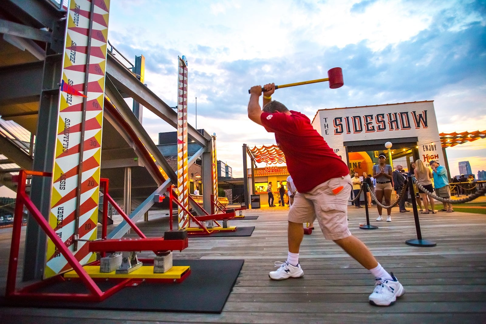 Skyline Park, on the roof of Ponce City Market, is the newest game in town with carnival games, cocktails, putt-putt, prizes, slides and rides. With a 10 dollar ticket access an original Sears Warehouse cargo elevator, learn a little history and enjoy a different view of the city. (Jenni Girtman / Atlanta Event Photography)