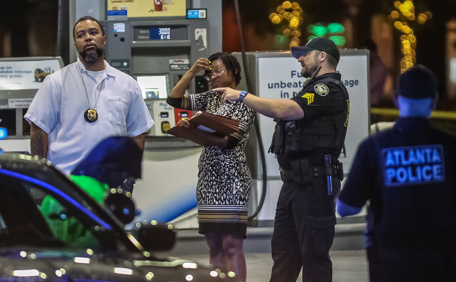 Atlanta police investigate a deadly shooting at a Chevron gas station at the intersection of Piedmont Road and Morosgo Drive early Thursday morning.