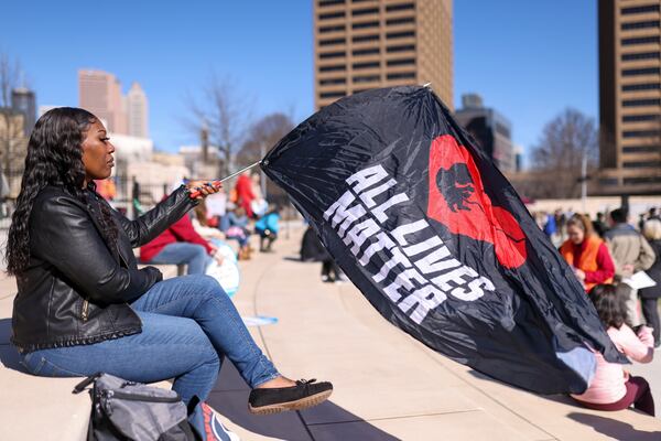 Anti-Abortion advocate Shannon Gatewood, of Douglas County, waves an “All Lives Matter,” flag during the Georgia March for Life rally at Liberty Plaza, Friday, Jan. 20, 2023, in Atlanta. This is the first time the Anti-Abortion advocates hold a rally since the Roe V. Wade was overturned. Jason Getz / Jason.Getz@ajc.com)
