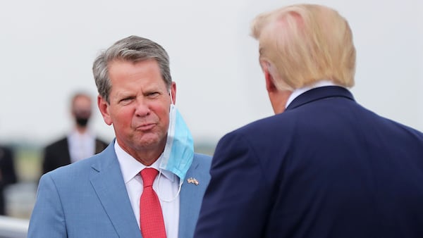 Georgia Governor Brian Kemp greets President Donald Trump as he visits Georgia, at Hartsfield-Jackson International Airport on July 15, 2020, in Atlanta, Georgia. (Curtis Compton/Atlanta Journal-Constitution/TNS)