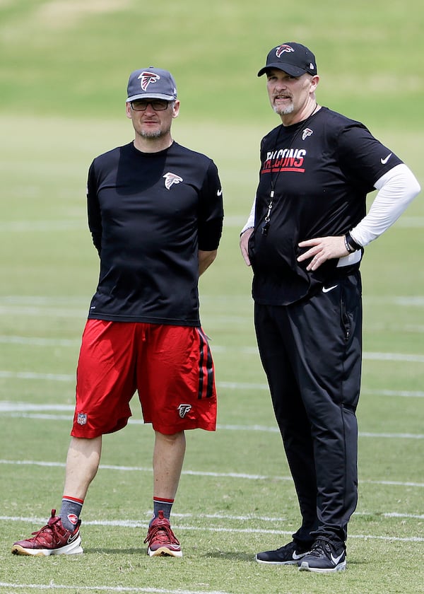 Falcons general manager Thomas Dimitroff (left) and coach Dan Quinn were among those in attendance at Georgia’s Pro Day.