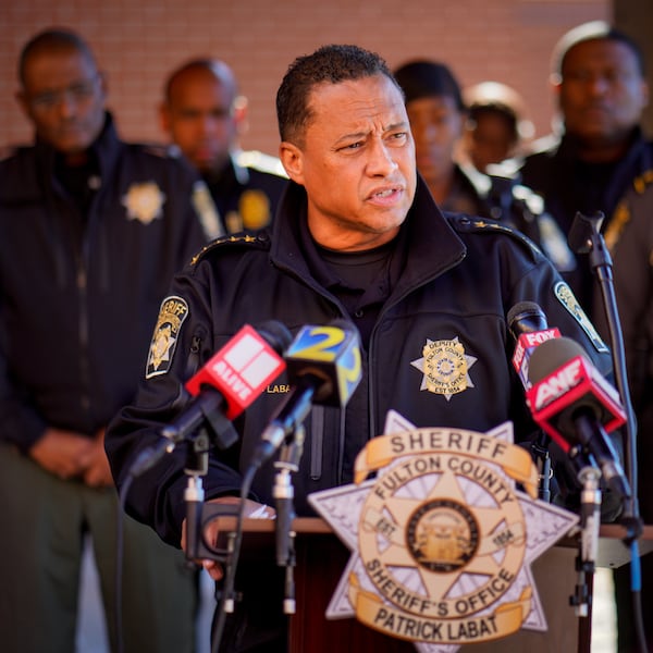 Fulton County Sheriff Pat Labat gives an update to the media regarding the shooting death of Deputy James Thomas on Thursday. Thomas' body was found in his wrecked car on Bolton Road. 