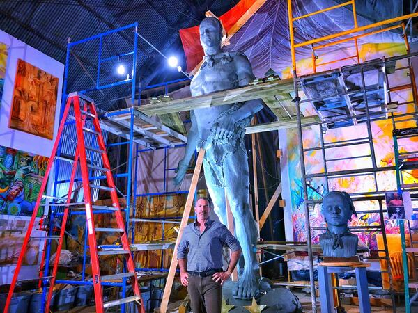 Athens artist Stan Mullins stands under the model he is using to cast the bronze statue of Chief Tomochichi for Rodney Cook Sr. Park in Atlanta. The statue will stand upon a column and is expected to be the first of $25 million in monuments to grace the park. The bronze casting is halfway done.