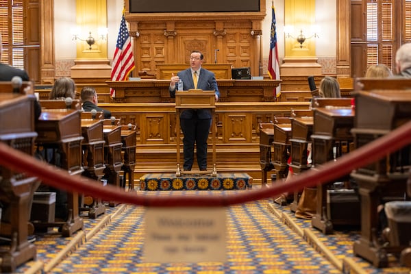 Georgia GOP Chairman and elector Joshua McKoon speaks to Georgia's Republican electors, who gathered in the Senate chambers at the state Capitol in Atlanta, Tuesday, Dec. 17, 2024, to formally cast their votes for Donald Trump and JD Vance. (Arvin Temkar/Atlanta Journal-Constitution via AP)