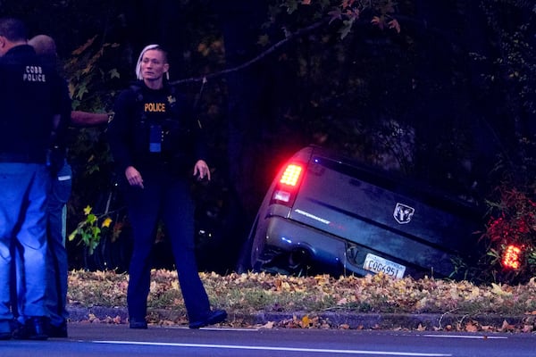 A vehicle went off the road Wednesday evening during an officer-involved shooting in Cobb County.