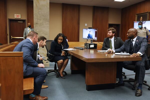 Fulton District Attorney Fani Willis speaks with her colleagues during the selection of the special grand jury to investigate allegations that former President Donald Trump criminally interfered with Georgia’s elections in 2020. Monday, May 2, 2022. (Miguel Martinez/miguel.martinezjimenez@ajc.com)