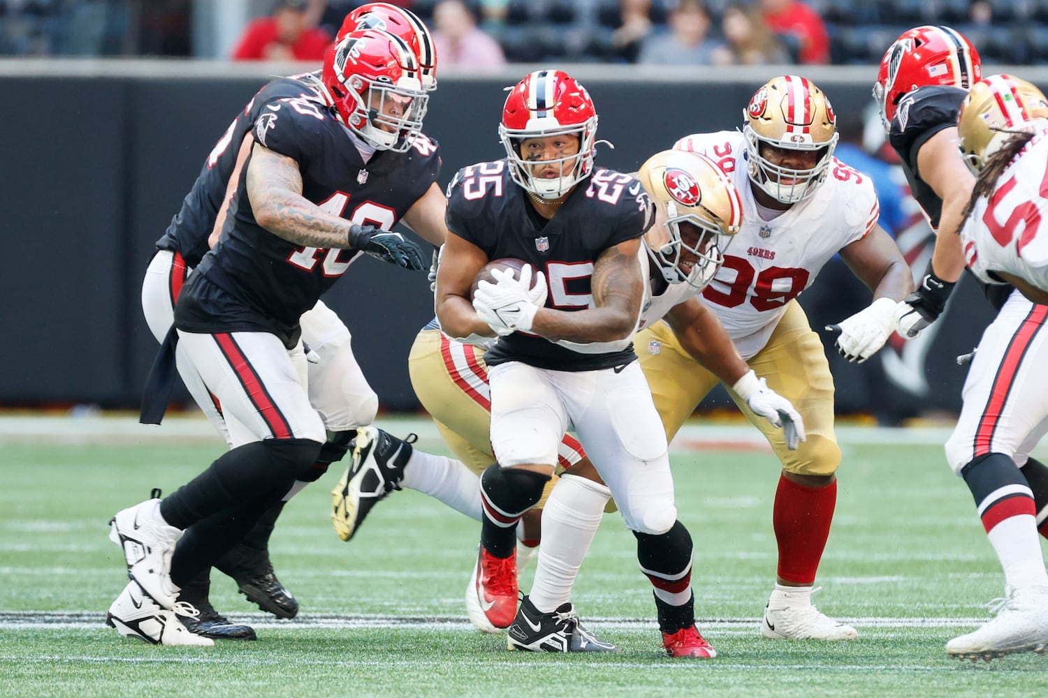 Falcons running back Tyler Allgeier looks for room during the second quarter against the 49ers on Sunday in Atlanta. (Miguel Martinez / miguel.martinezjimenez@ajc.com)