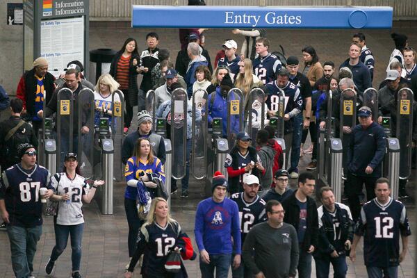 Passengers arrive at the Georgia World Congress Center MARTA stop before the Super Bowl 53 football game between the Los Angeles Rams and New England Patriots, Sunday, Feb. 3, 2019, in Atlanta. BRANDEN CAMP/SPECIAL