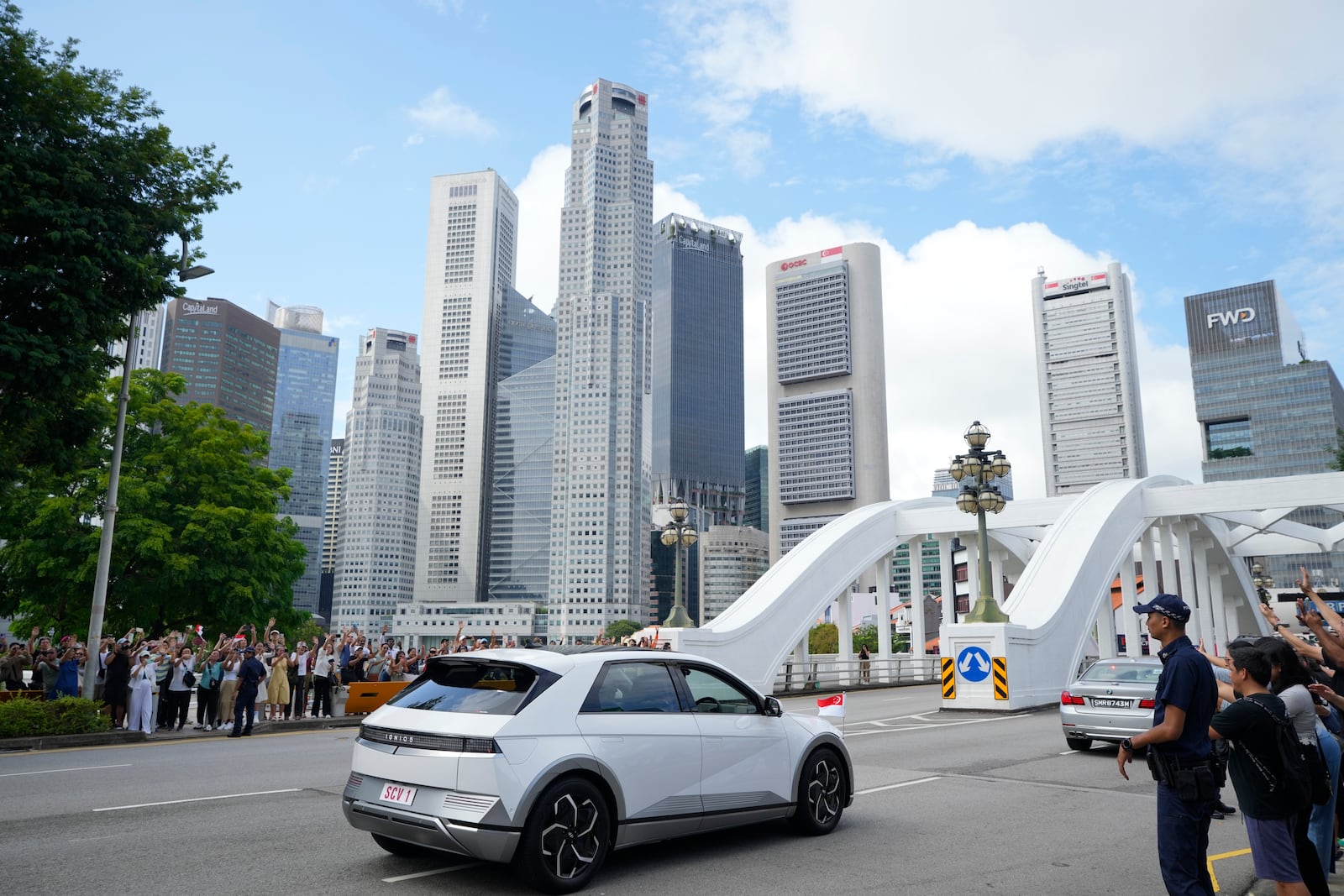 The car carrying Pope Francis leaves from the Parliament House in Singapore, Thursday, Sept. 12, 2024. (AP Photo/Vincent Thian)