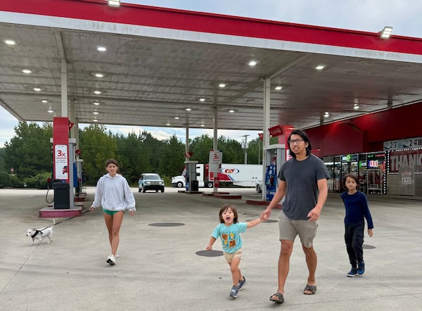 Amy Hudson and her husband, Bryan Wong, evacuated their family from their home in Morgan County. Pictured left to right: Elle, 14, Lark, 3, Bryan and Lauder, 10, head back to the car after a rest stop on their way to Birmingham, Alabama.