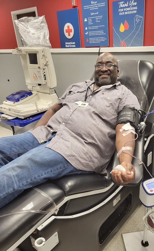 Barry Hundley recently gives blood in late November at the Midtown Blood Donation Center.