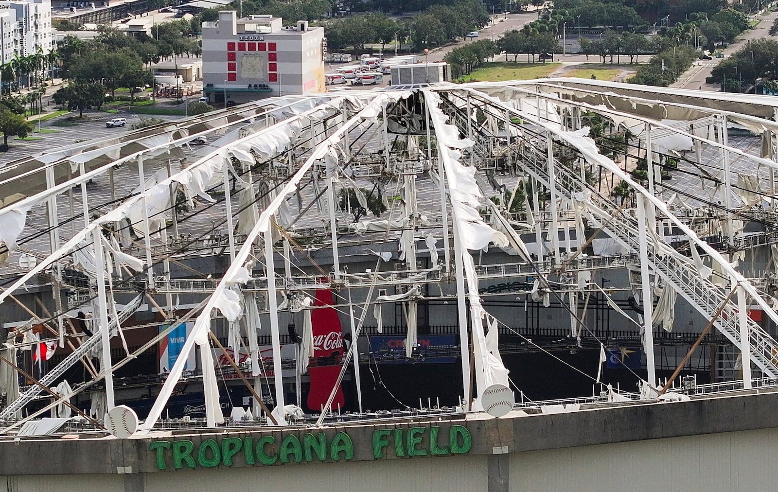 An aerial drone view shows Tropicana Field with the roof damaged after Hurricane Milton in downtown St. Petersburg, Fla., on Thursday, Oct. 10, 2024. (Dirk Shadd/Tampa Bay Times via AP)