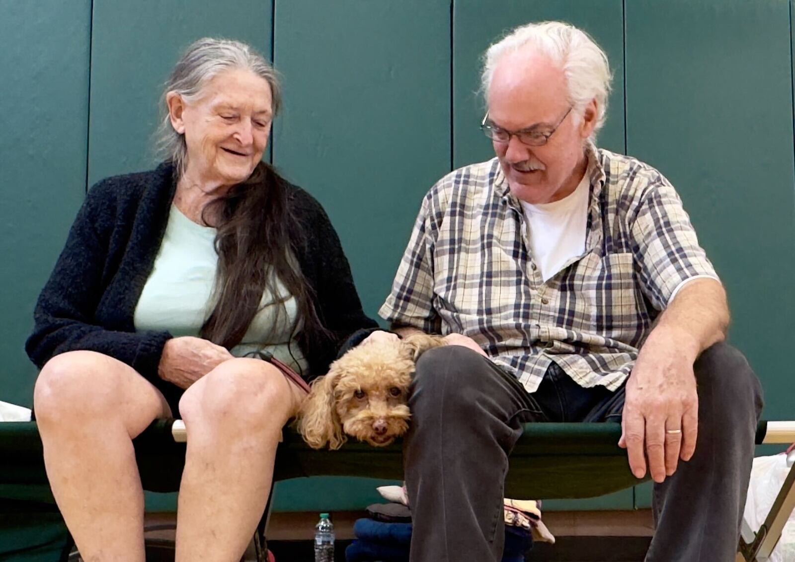 Edward Rasmussen, 77, and wife Pauline, 82, and their poodle Minnie, evacuated from Florida to Georgia.