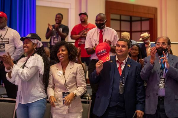 09/25/2020 - Atlanta, Georgia - President Trump supporters cheer during a Blacks for Trump campaign rally at the Cobb Galleria Centre in Atlanta, Friday, September 25, 2020.  (Alyssa Pointer / Alyssa.Pointer@ajc.com)