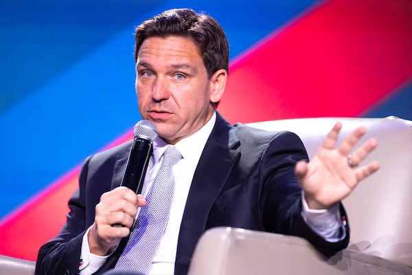 Florida governor and Republican presidential candidate Ron DeSantis speaks to WSB radio host Erick Erickson at The Gathering conservative political conference in Buckhead on Friday, August 18, 2023. (Arvin Temkar / arvin.temkar@ajc.com)