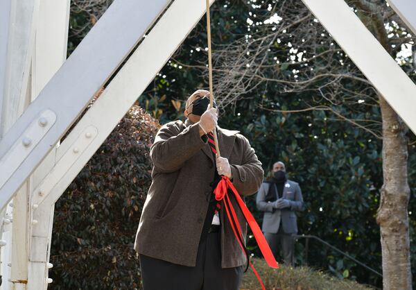 January 9, 20201 Athens - Hamilton Holmes Jr., son of Hamilton Holmes Sr., rings the Chapel Bell to honor the 60th anniversary of desegregation of the University of Georgia outside the UGA Chapel on the campus in Athens on Saturday, January 9, 2021. On January 9, 1961, two courageous students, Hamilton Holmes and Charlayne Hunter, took heroic steps on the University of GeorgiaÕs campus to enroll as students followed by Mary Frances Early, who entered graduate school that summer. Their legacies continue as they have contributed a lifetime of public service to their communities. Because of these students, the university now boasts a diverse campus made of numerous nationalities, races and ethnicities. (Hyosub Shin / Hyosub.Shin@ajc.com)